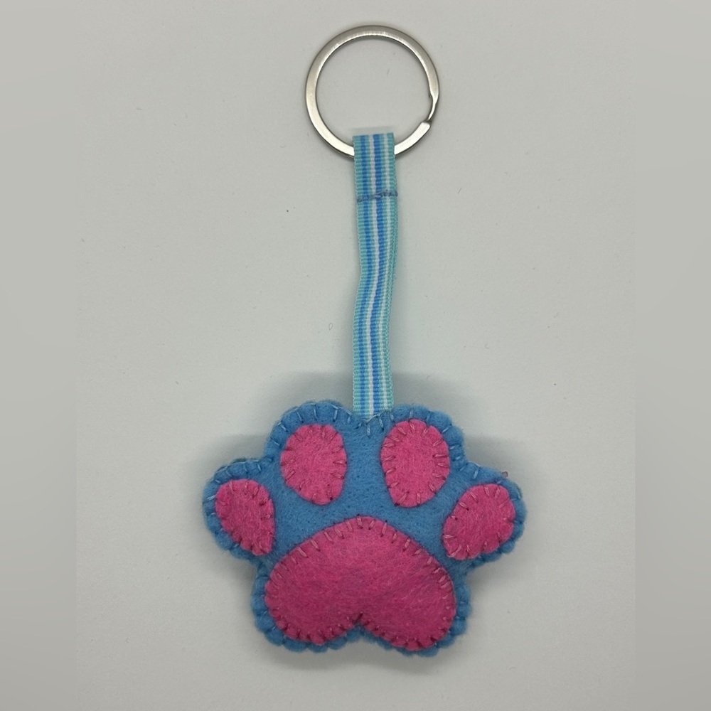 Handmade key fob in the shape and design of a dogs paw.